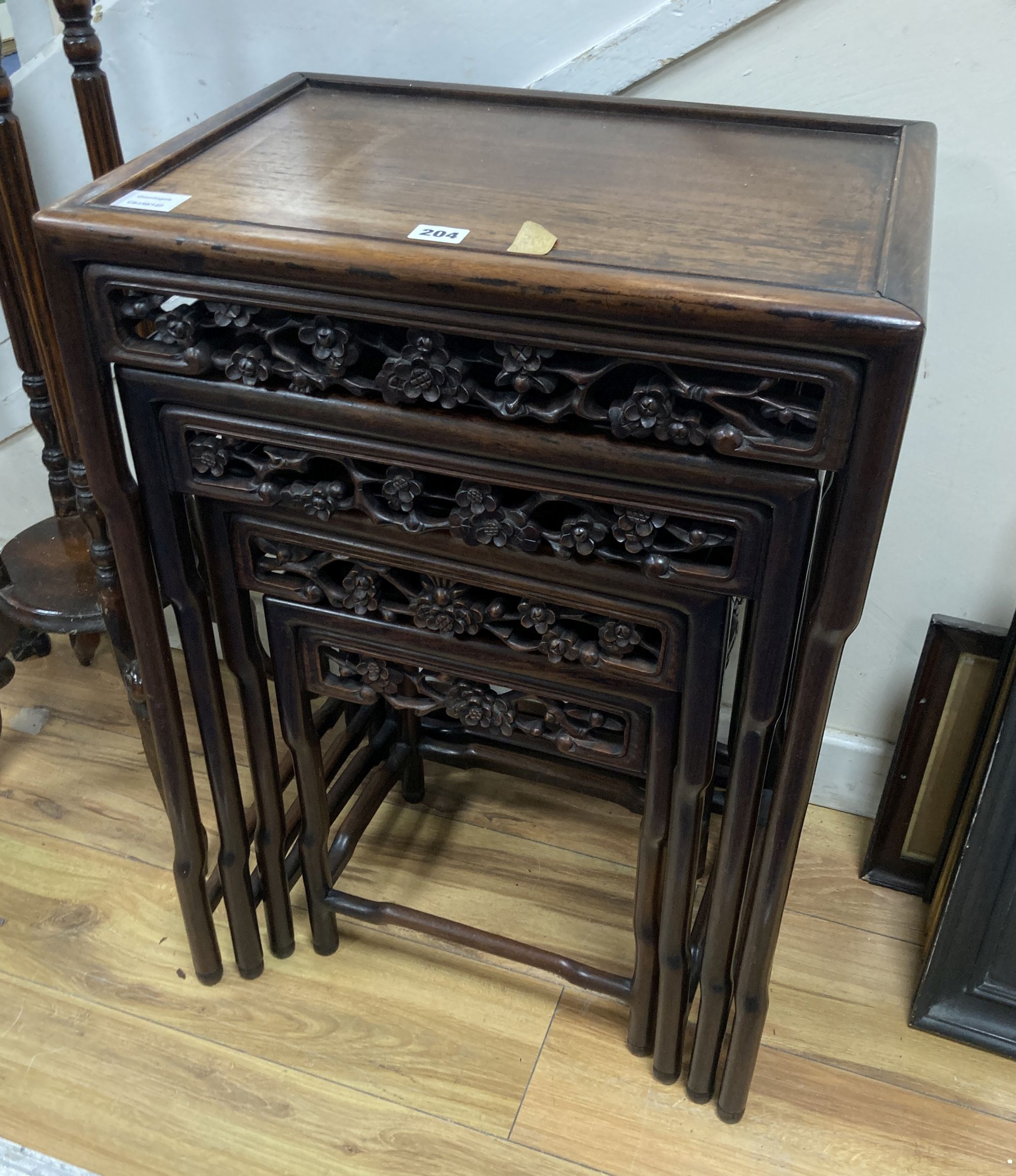 A Chinese nest of four hongmu tables, width 50cm depth 36cm height 72cm